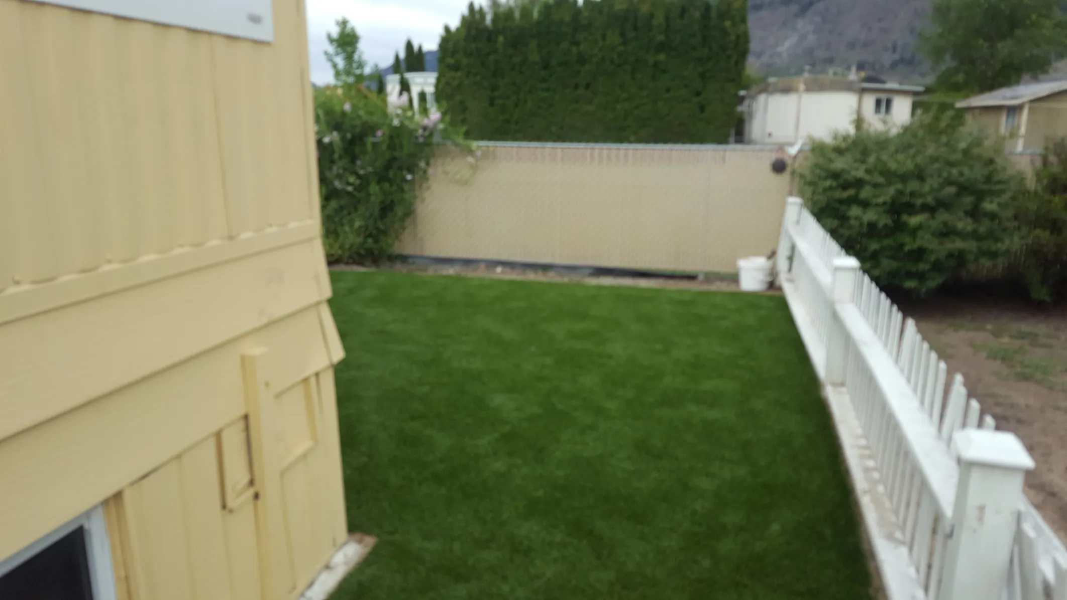 Horizontal fence panels with modern design and secure post setting in South Okanagan