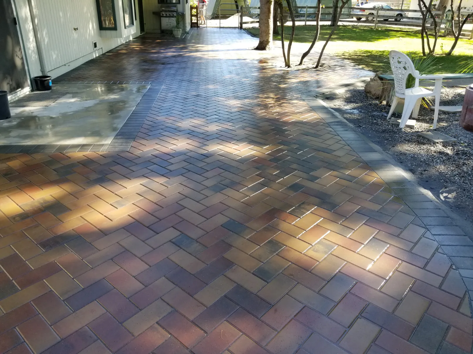 Circular paver patio design with soldier course border and fire pit area in South Okanagan BC